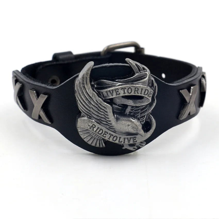Black geometric leather bracelet with a silver watch-button clasp on a unisex wrist.