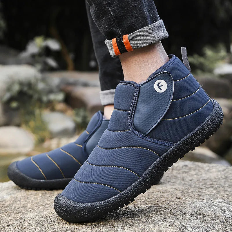 Men's waterproof snow boots in black with a cotton upper and thick rubber sole.