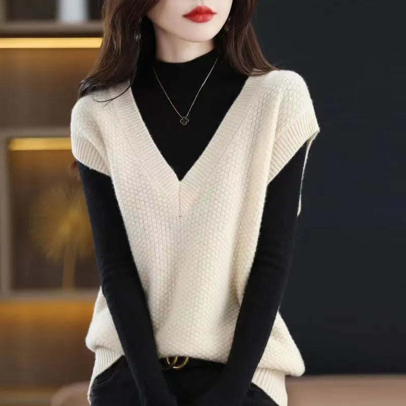 Sleeveless pullover vest with 3D knit pattern in creamy-white colour, shown on hanger