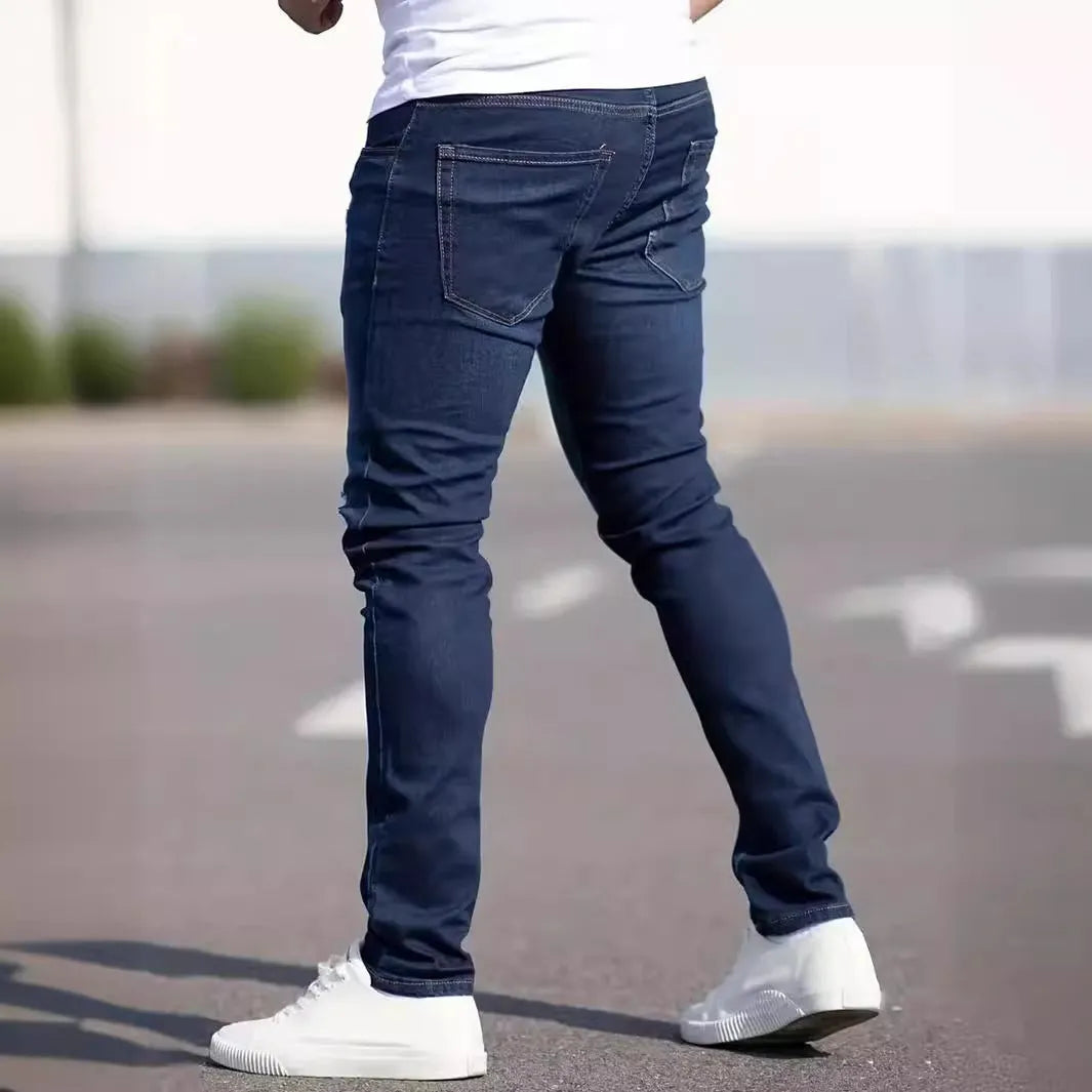Men's dark blue slim fit jeans with skinny leg design and mid waist cut