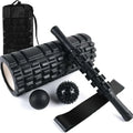 Black 33cm fitness foam roller with six gear massage bar pieces on grey background