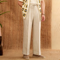 Women's linen high-waist trousers with elasticated waistband in navy blue, white, and greige colours