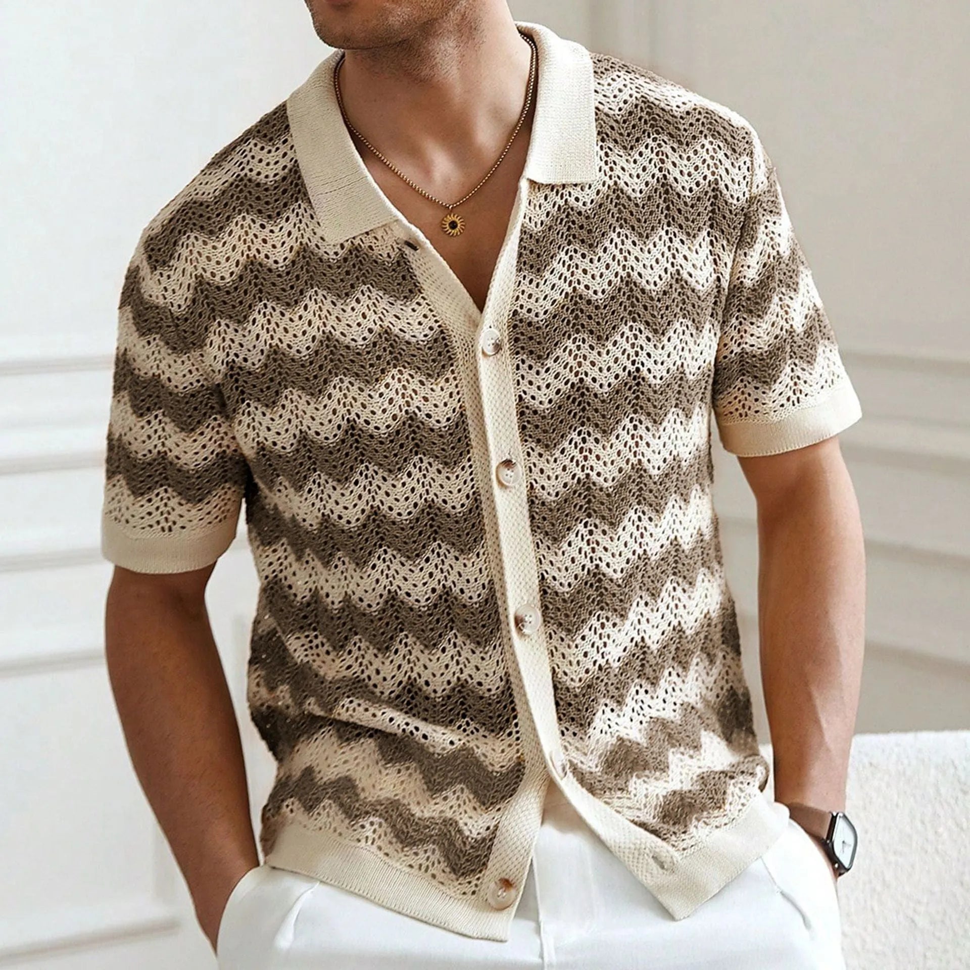 Short sleeve blue hollow jacquard corrugated sweater with flocking detail on a hanger.