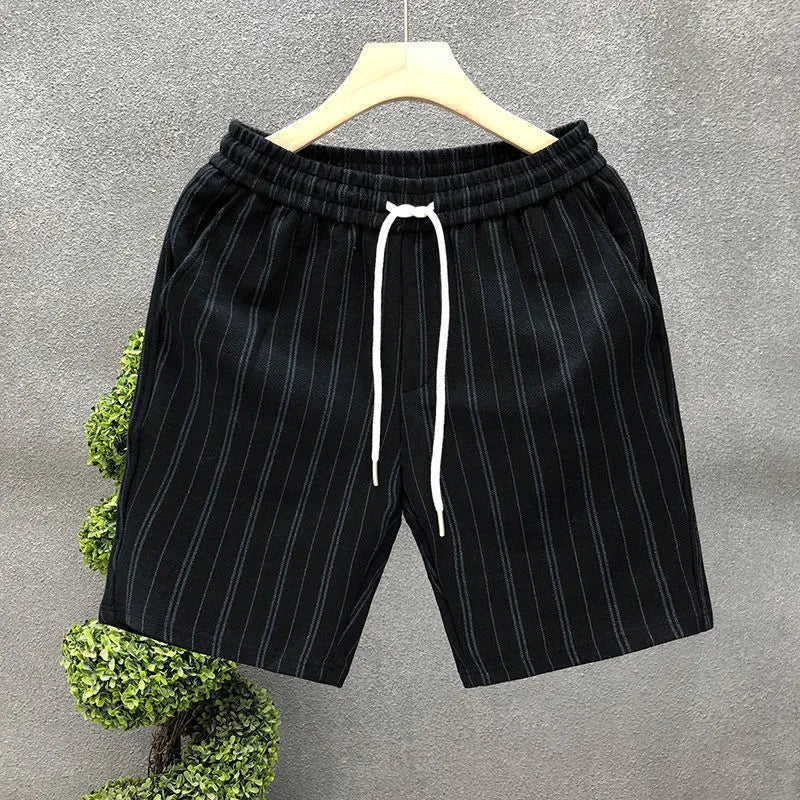 Men's black and white striped casual shorts with a fleece lining and double-layer waistband.