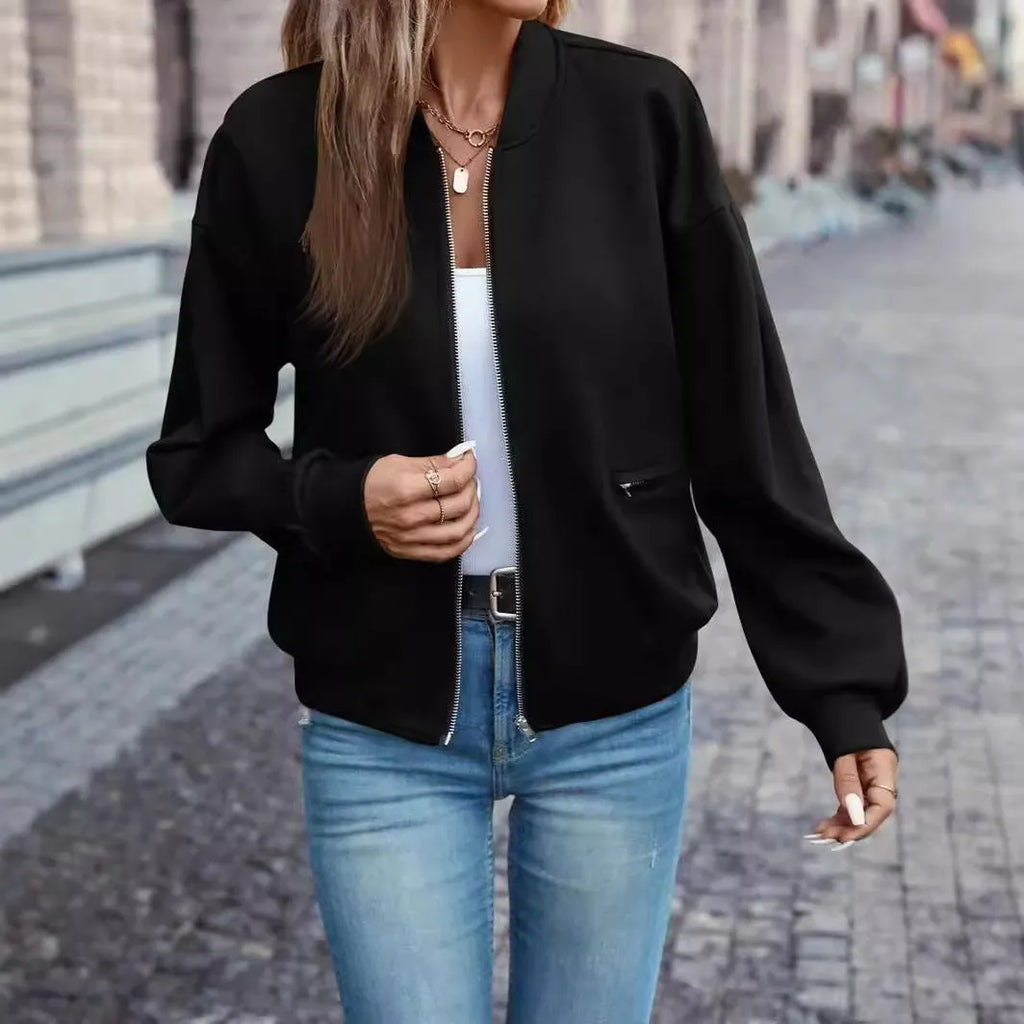 Black women's casual zip-front jacket with long sleeves and faux pockets.