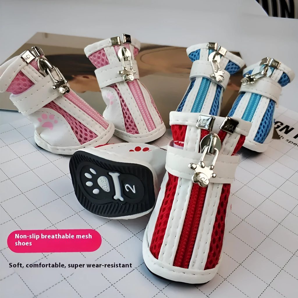 Four blue cloth dog shoes for small dogs with front zipper closure on a white background.