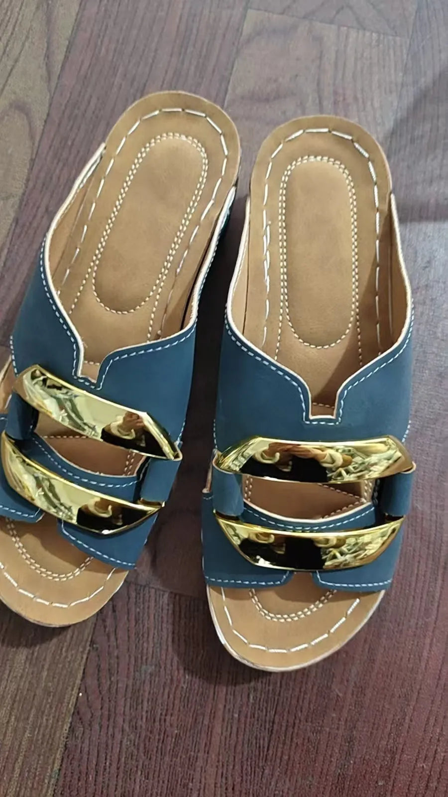 Adult Roman style platform sandals in a solid colour with a strap design and flat rubber sole.