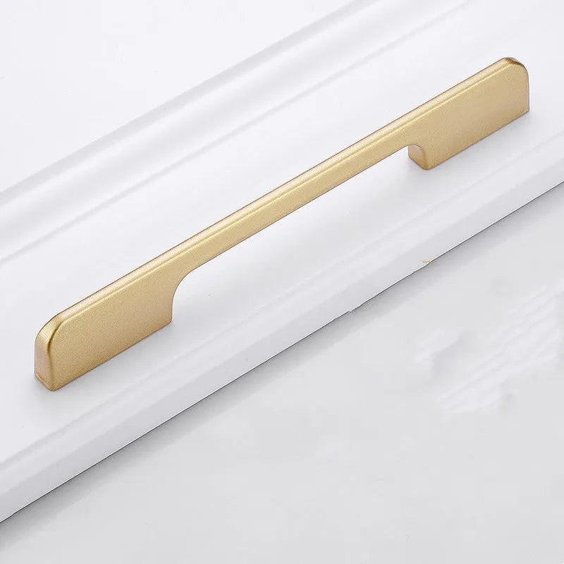 Gold aluminium alloy single-hole T-shape cabinet drawer handle on white background.