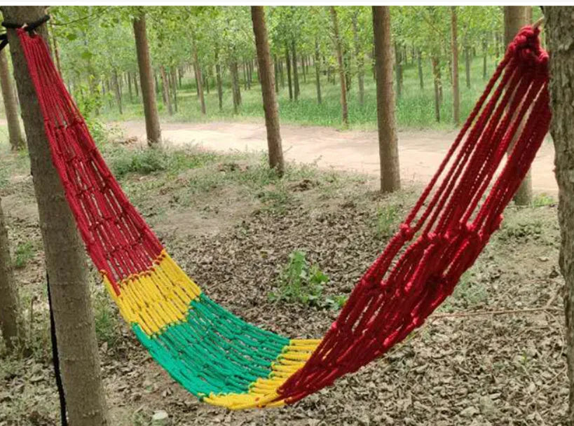 Outdoor nylon rope mesh hammock showing bold weave style, displayed with included tying ropes.