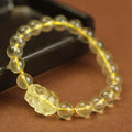 Yellow leather Pi Xiu bracelet with artificial crystal charm beads in Chinese simple style