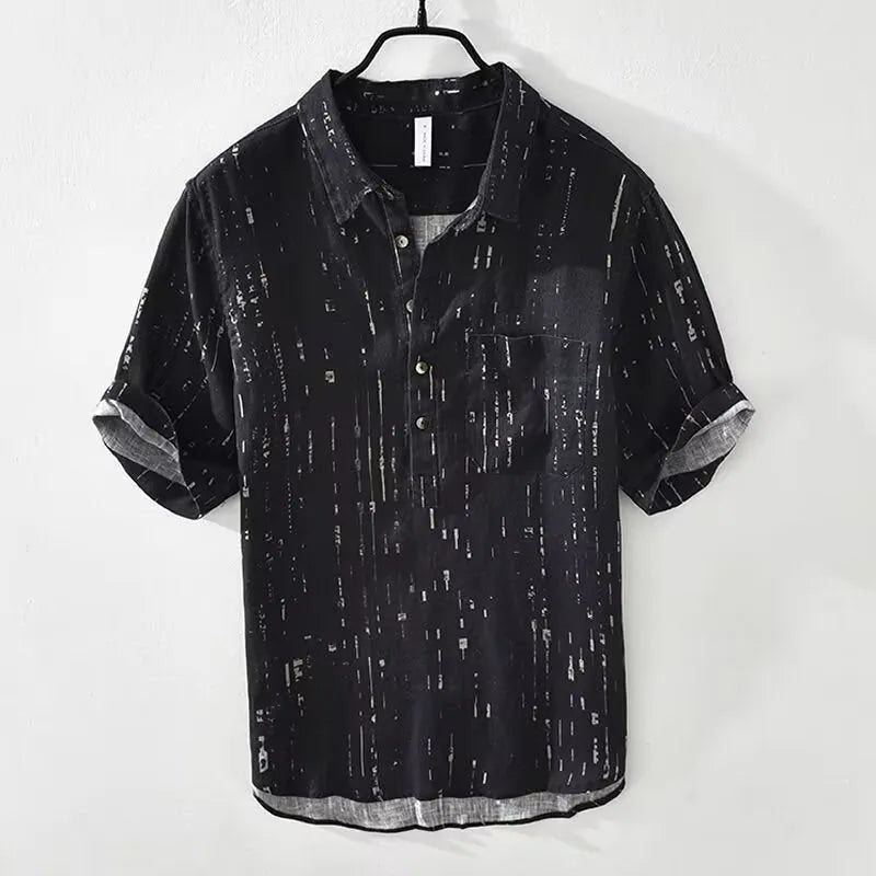 Men's loose fit short sleeve polo shirt in black, showing lapel collar and cardigan style