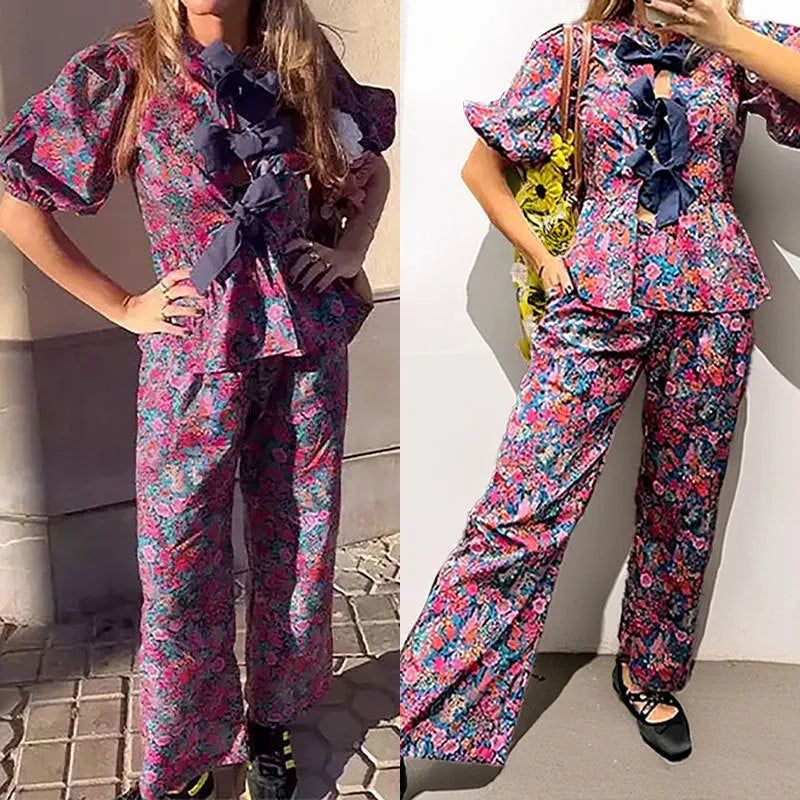 Women's floral print trousers suit with tie-neck top and puff sleeves