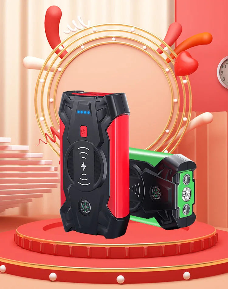 Red portable car jump starter with thick clips and digital display for emergency vehicle battery boosting