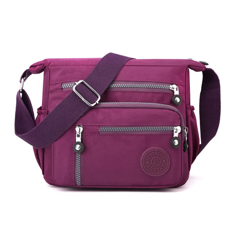 Nylon messenger bag in square vertical shape with single shoulder strap, shown in one of five colour options