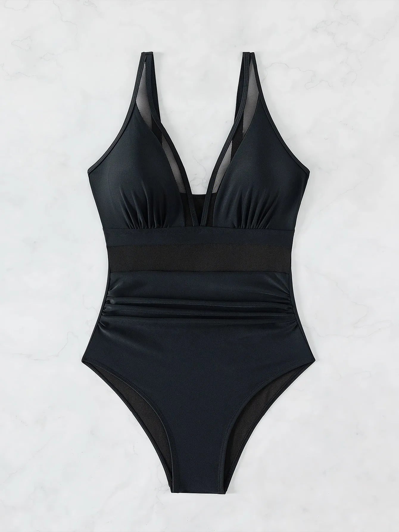 Black halter neck one-piece swimsuit with mesh detail, shown on model.