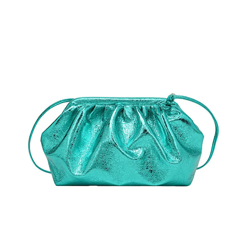Shell-shaped crossbody bag with hair clip shoulder strap showing multiple compartments including mobile phone pocket
