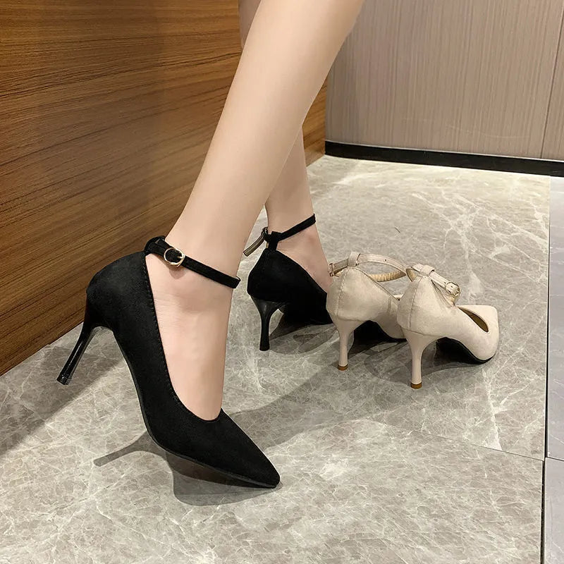 Women's black stiletto heel pump shoes with buckle detail and 8cm heel height