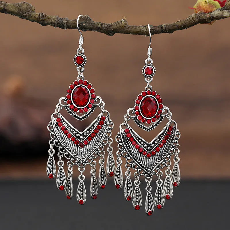 Pair of long purple drop earrings with a cascading fringe design and retro ethnic style.