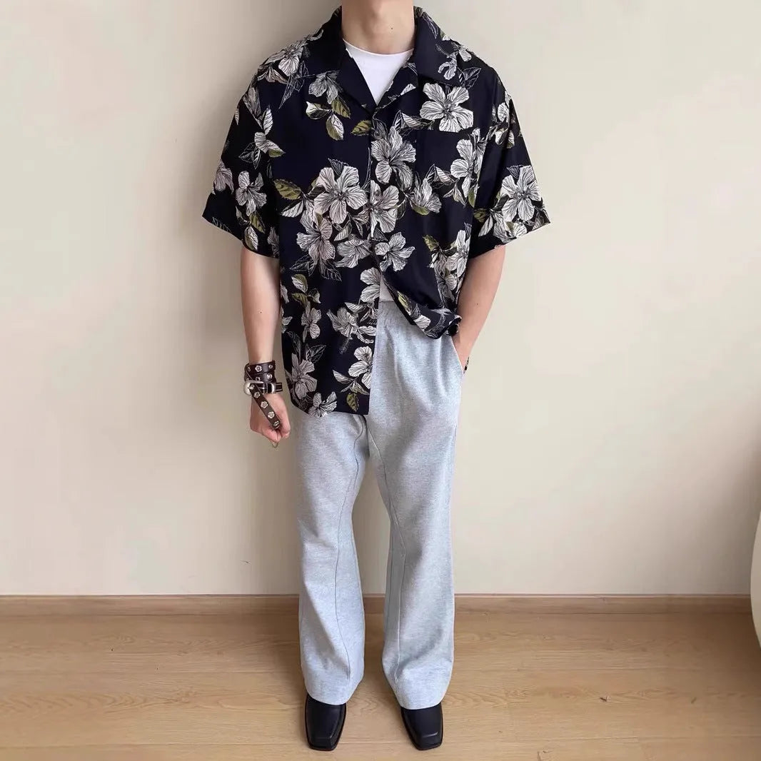 Black vintage Cuban collar ice silk shirt with flower print and short sleeves.