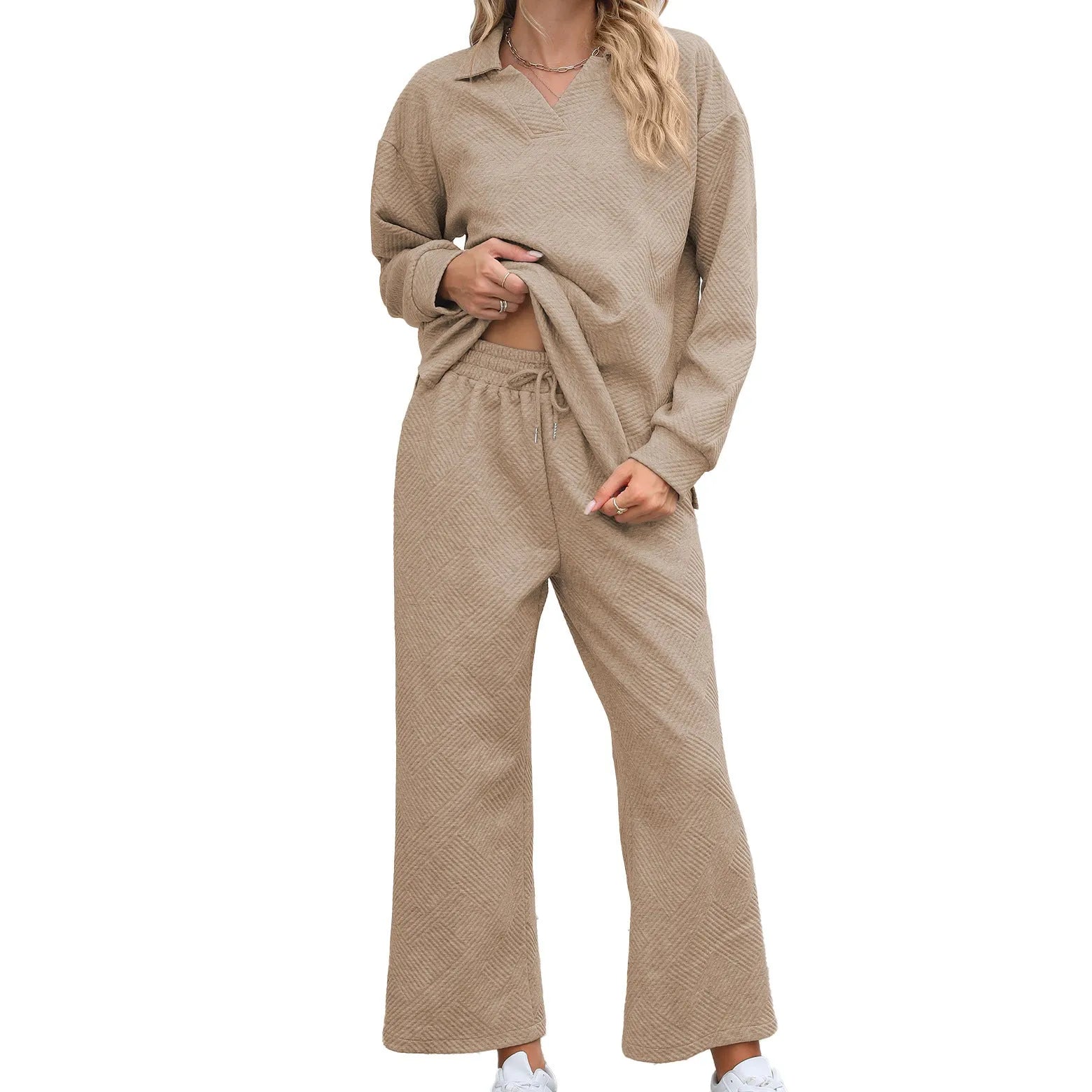 Women's solid colour lapel long sleeve knit jumpsuit with elastic waist trousers in jacquard fabric.