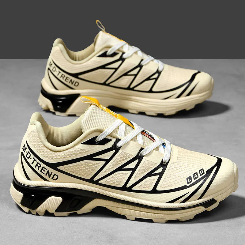 Low-top hiking shoes in khaki with rubber soles and front lace-up closure.