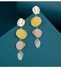 A pair of disc-shaped alloy earrings with a Morandi three-colour dripping oil finish on a sterling silver needle post.