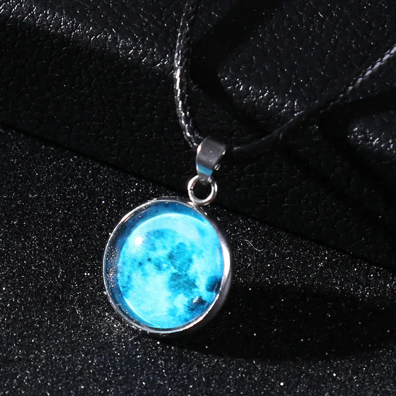 Alloy necklace with luminous glass pendant showing Christmas moon night sky and constellation design.