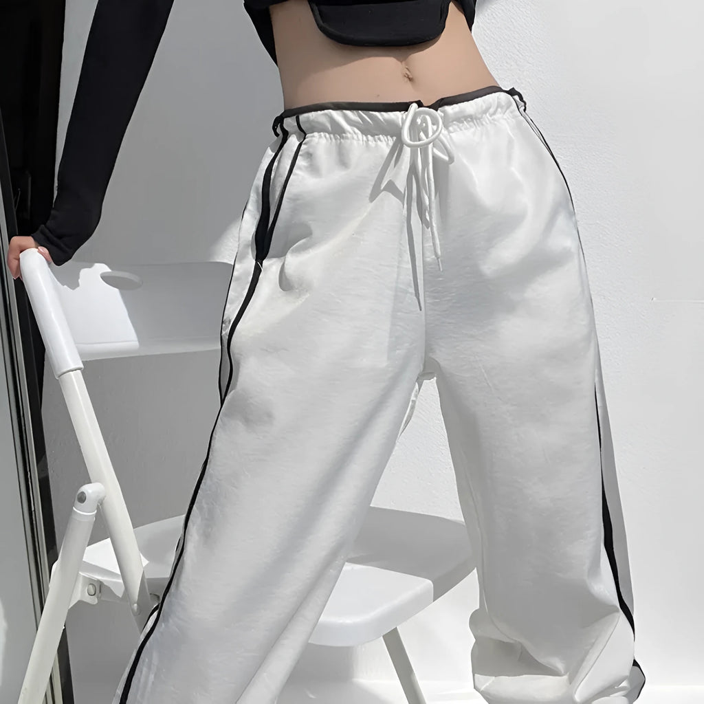 Women's navy blue loose straight trousers with white ribbon parallel bar waistband detail