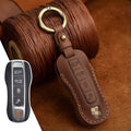 Authentic brown cowhide leather Porsche key case with a retro metal buckle closure.