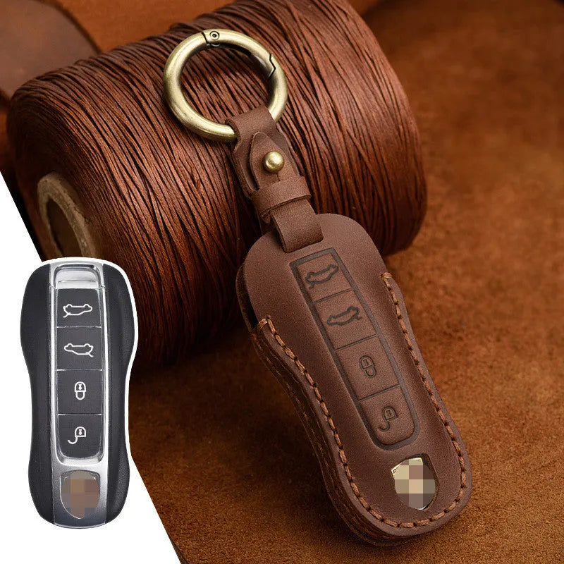 Authentic brown cowhide leather Porsche key case with a retro metal buckle closure.