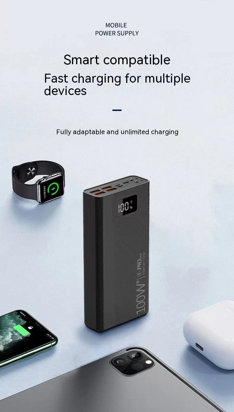 Large capacity black and white plastic power bank showing size relative to a smartphone.