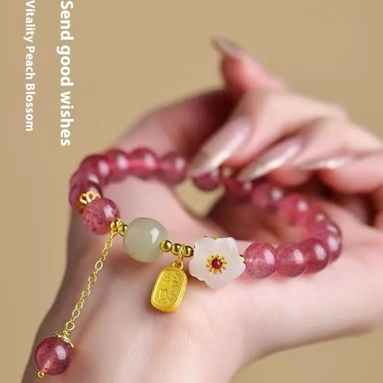 Handmade natural crystal bracelet with strawberry quartz decorative elements in pearl, moon, XINGX, or green design options
