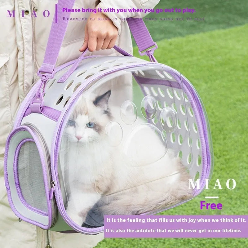 Transparent hard EVA space capsule backpack for cats, shown in green, with shoulder straps and large viewing window.