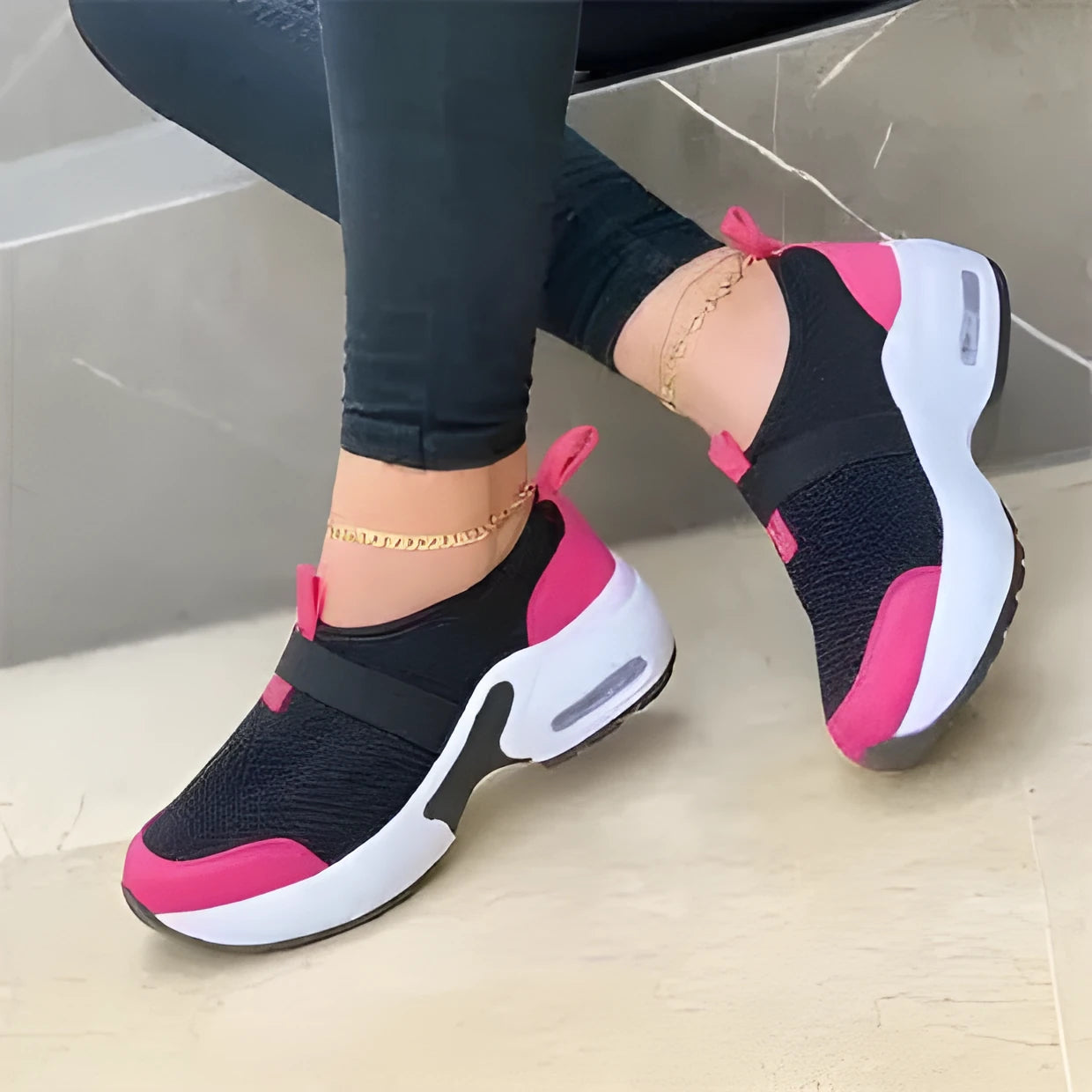 Women's white mesh flat sneakers with a rubber sole shown from the side.
