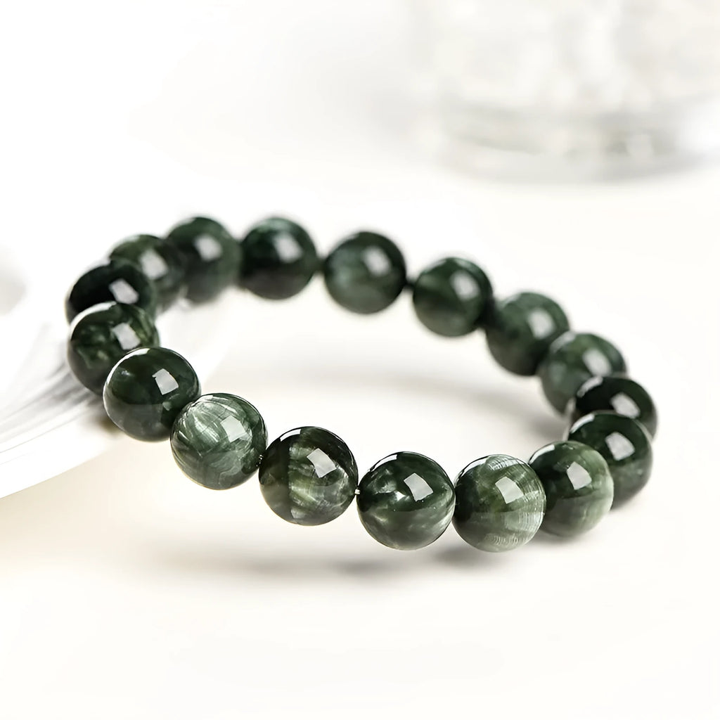Green Dragon Crystal bracelet with 8-9mm round beads featuring geometric Ruyi design elements