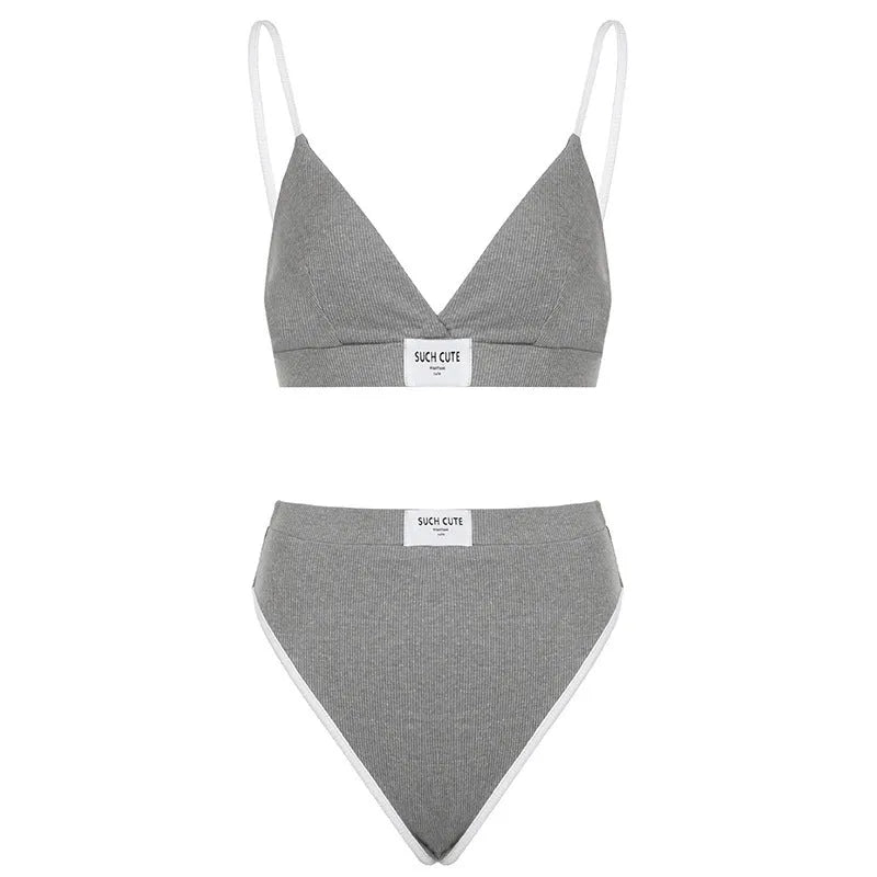 Grey women's bikini set with white contrast binding and embroidery detail on the top.