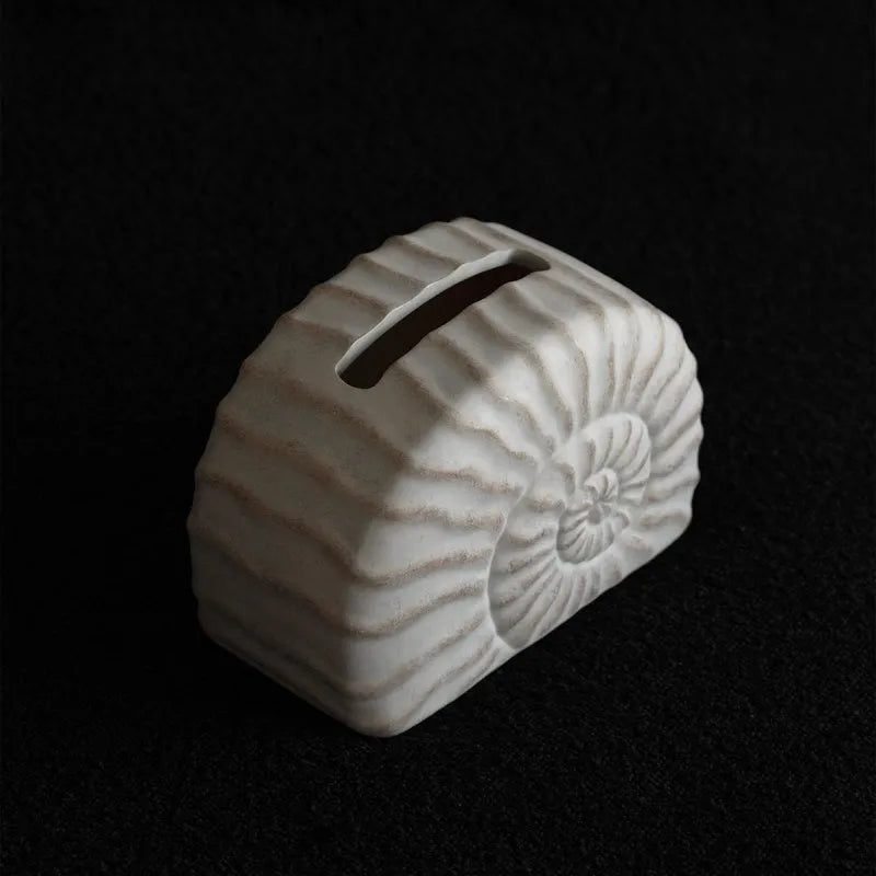 Modern minimalist resin tissue box holder in a conch ramble colour and pattern.