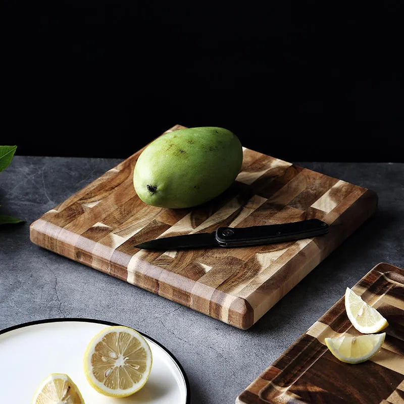 Brown acacia wood parquet cutting board with 3cm thickness on kitchen counter