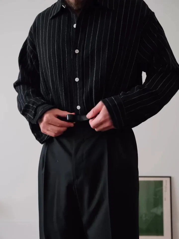 Black pinstriped button-down shirt on hanger showing regular fit and classic striped pattern