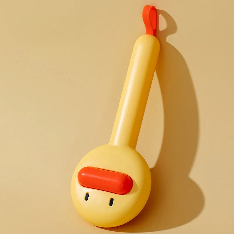 Small yellow duck-shaped pet grooming comb with open section and needle teeth