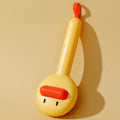 Small yellow duck-shaped pet grooming comb with open section and needle teeth