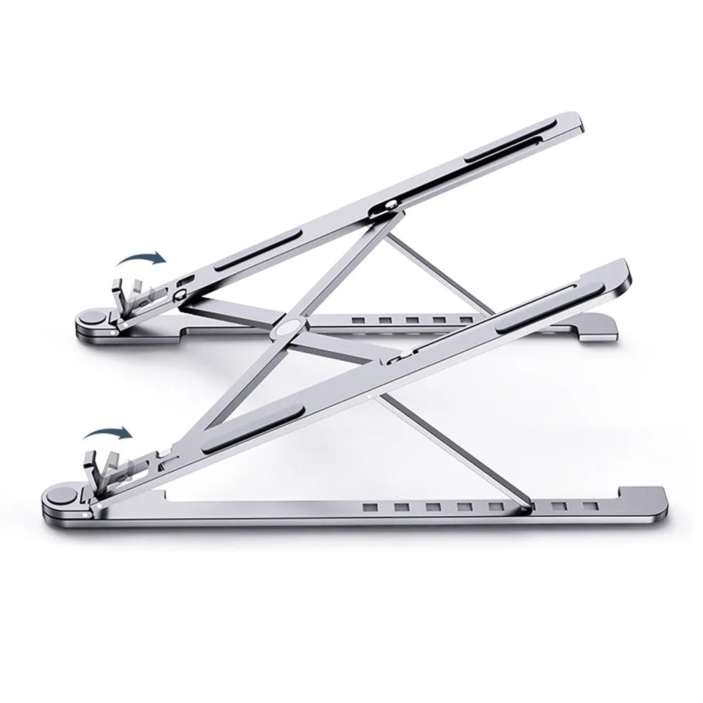 Silver foldable aluminium laptop stand holding a MacBook at an angle, shown next to a backpack.