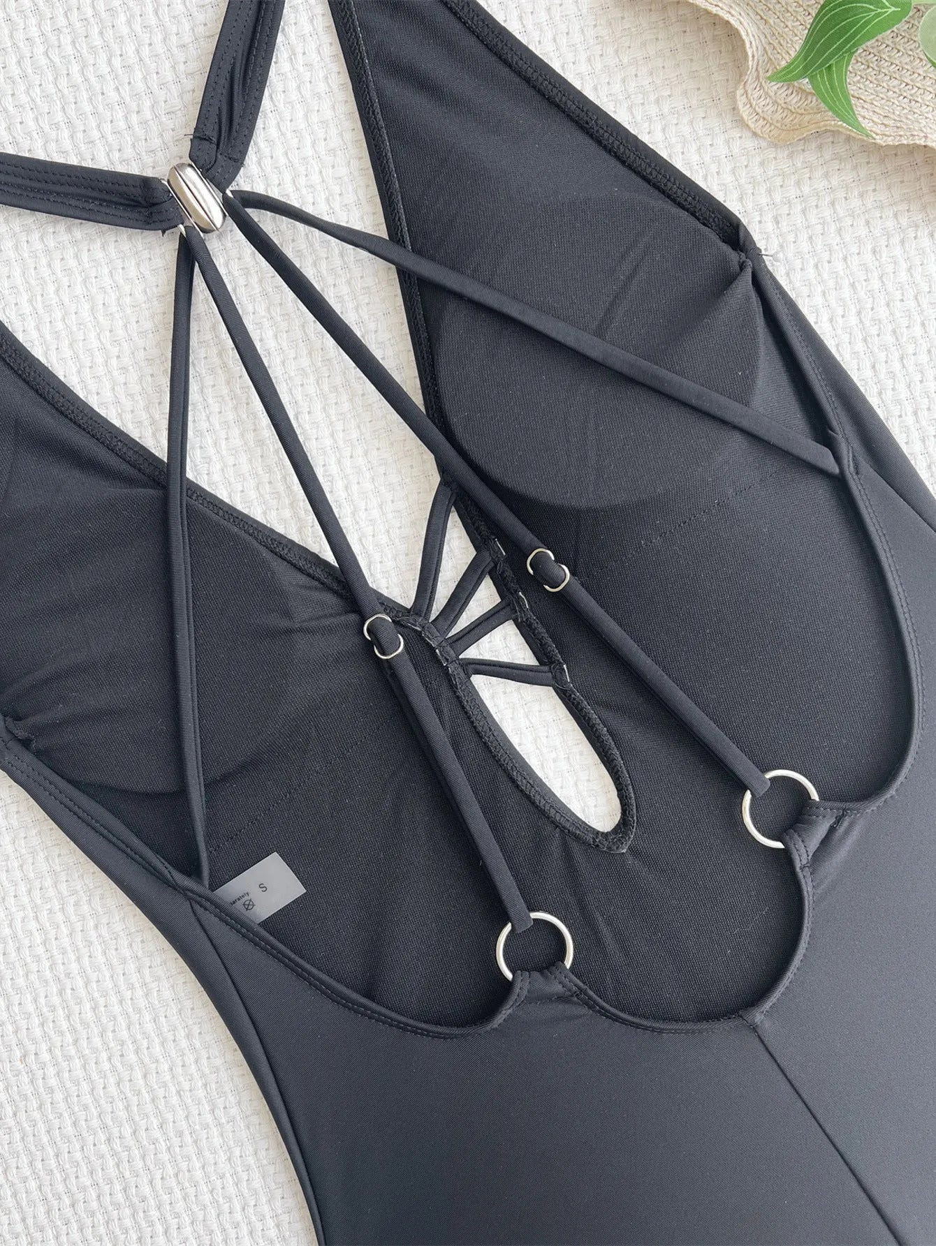 Women's solid black one-piece swimsuit made from nylon fabric for swimming