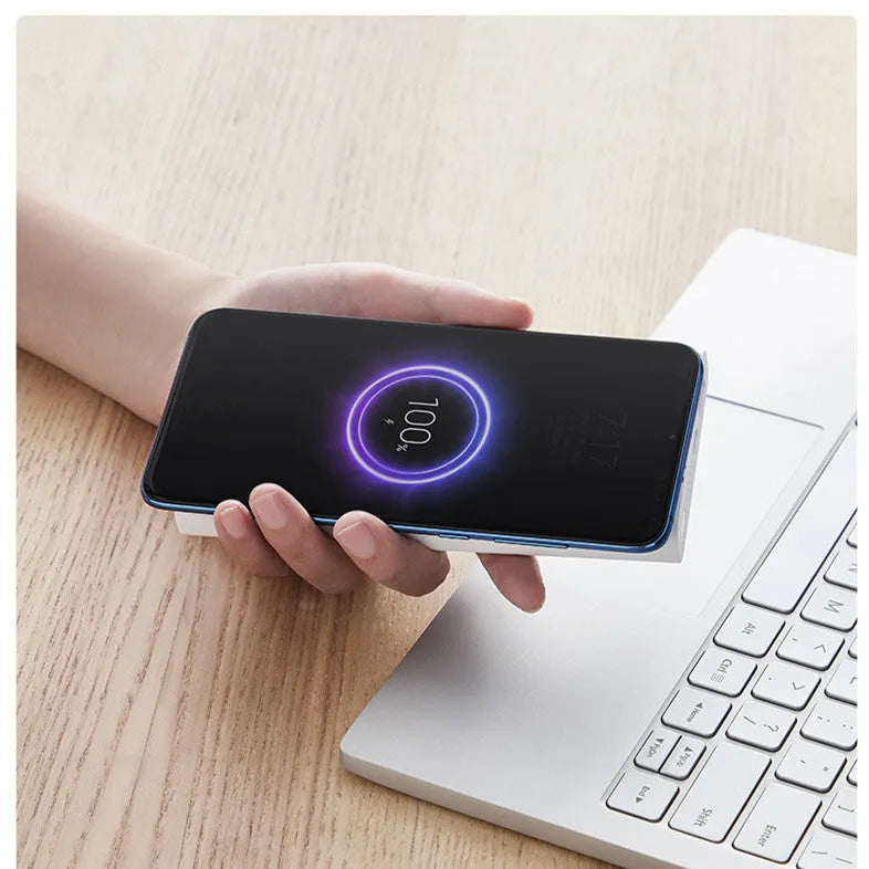 Black and white 10000mAh capacity power bank with USB and Type-C ports for fast and wireless charging