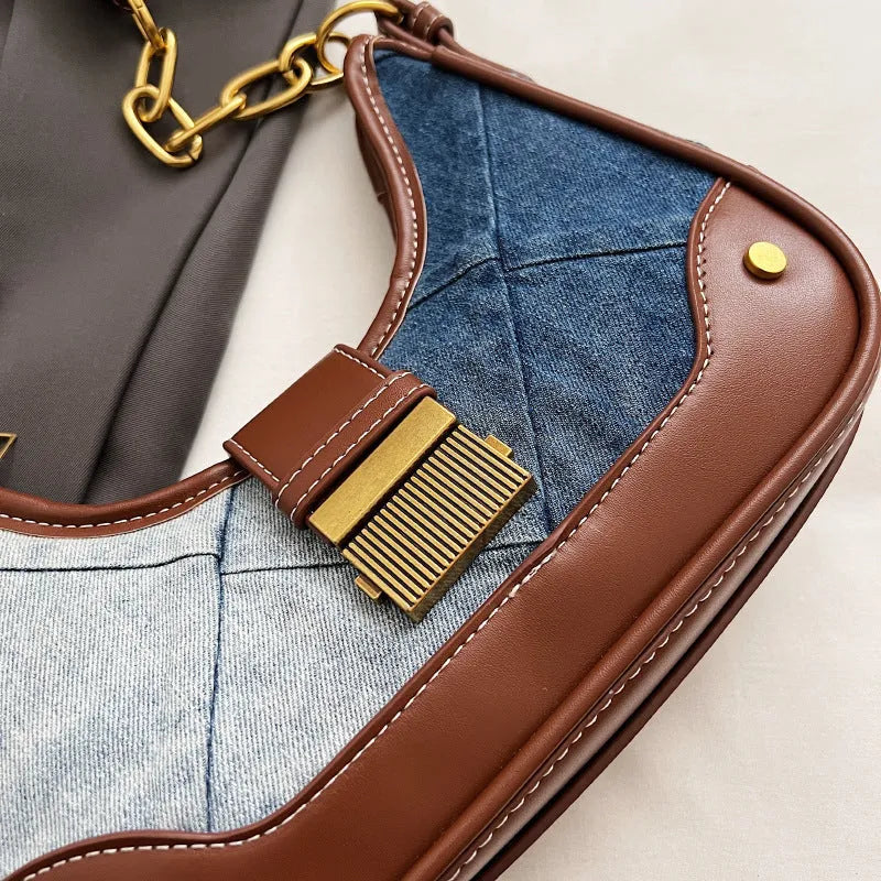 Brown denim women's shoulder bag with diamond mesh panel and chain strap showing bucket shape