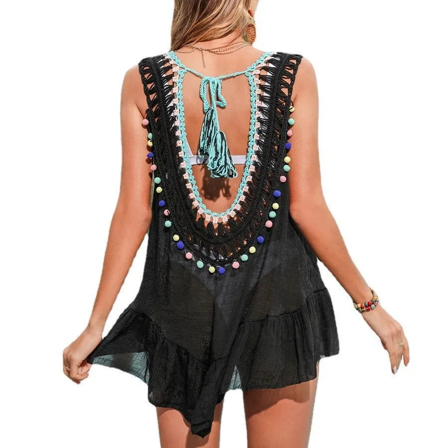 Black hand-crocheted women's beach cover-up vest with a cut-out design and ruffled trim.