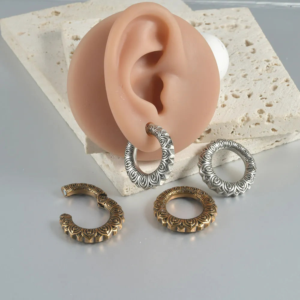 Pair of dragon motif alloy earrings with geometric hollow out design in antique silver colour