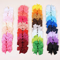 Assortment of 20 colourful handmade grosgrain ribbon hair bows with alligator clips for toddlers.