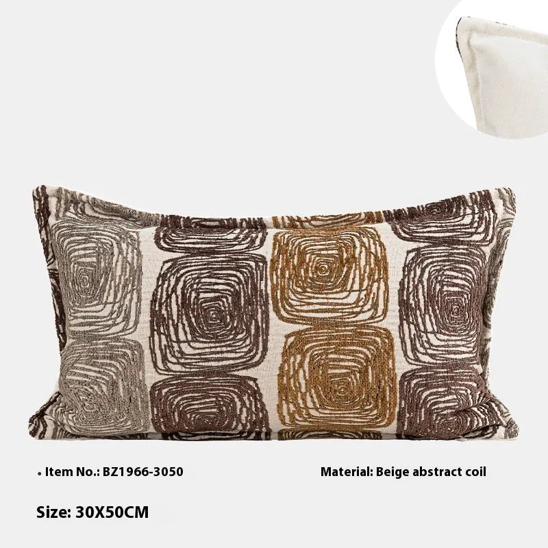 Cream and coffee-coloured abstract coil pattern on a square polyester pillow cover.