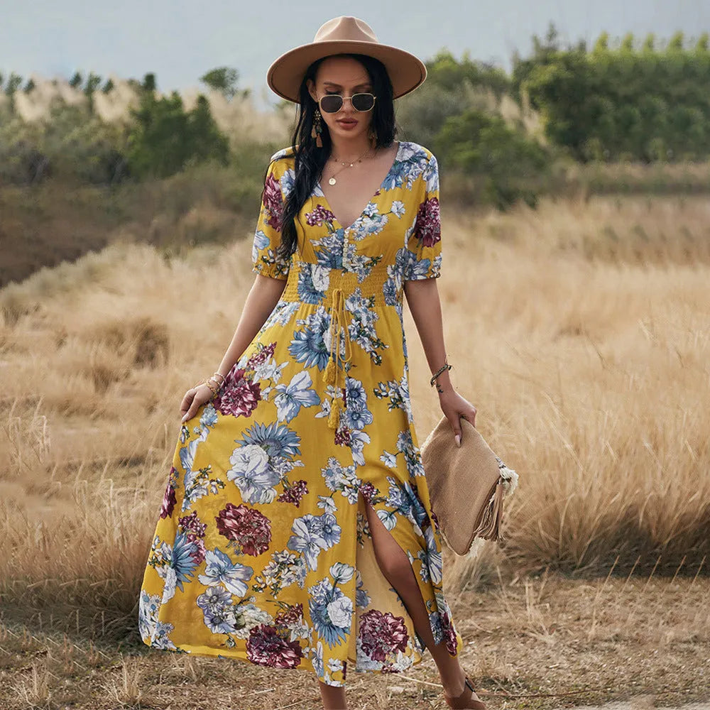 Women's floral print summer dress with V-neck, elastic waist, and large hemline skirt in yellow colour